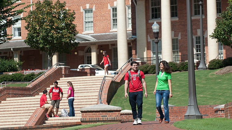Two prospective students explore the Court of North Carolina on NC State campus.