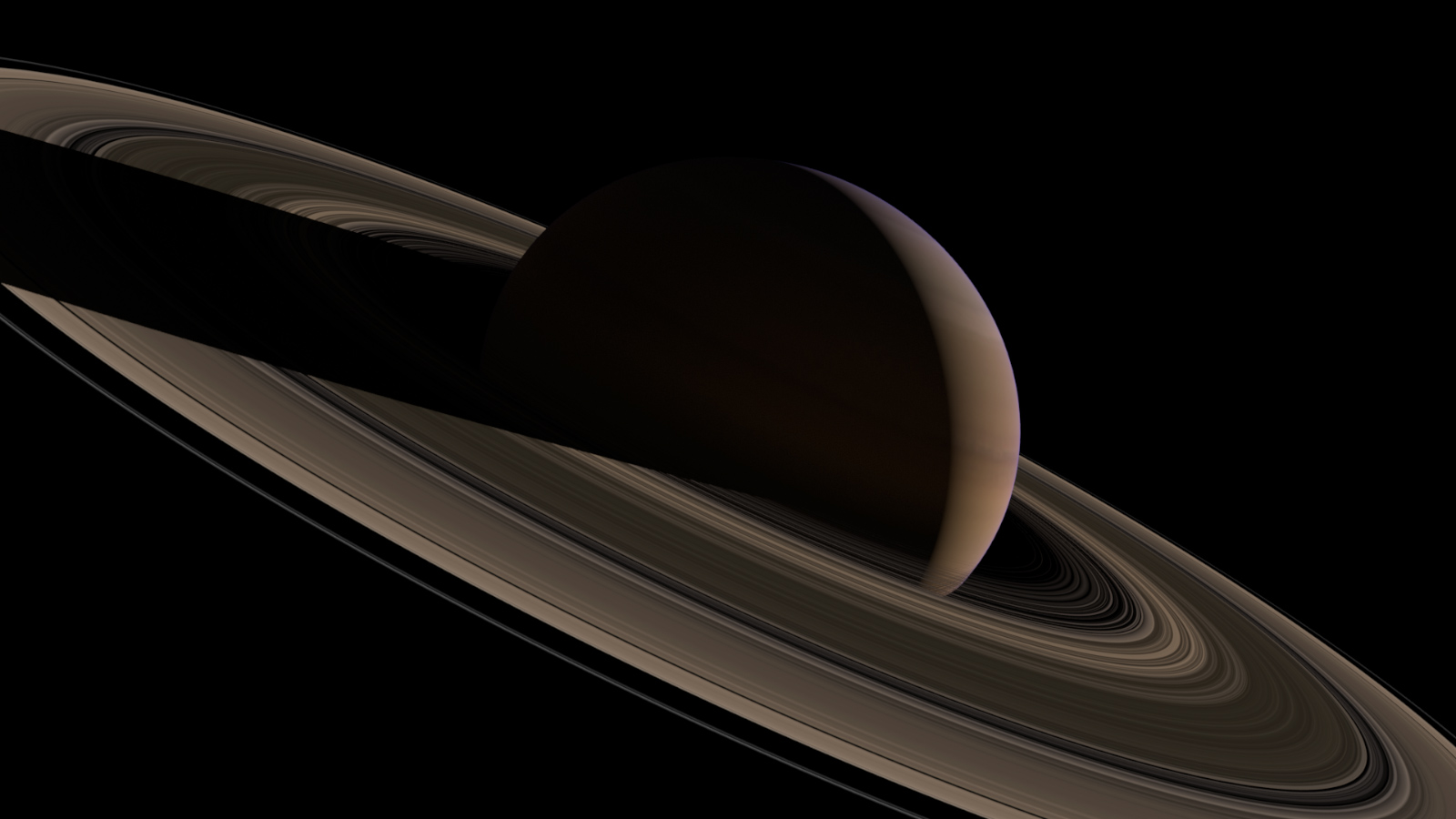 slide 4 - Saturn and its rings illuminated by the Sun.