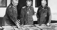 Meeting of leaders in W.W.I, General Hindenburg, Kaiser William II, General Ludendorff examine maps during World War I in Germany.